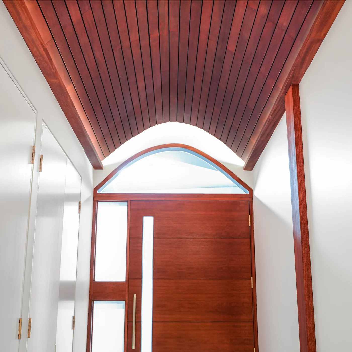 Arched jarrah ceiling over the entry at Balmoral, carrying through to the front door