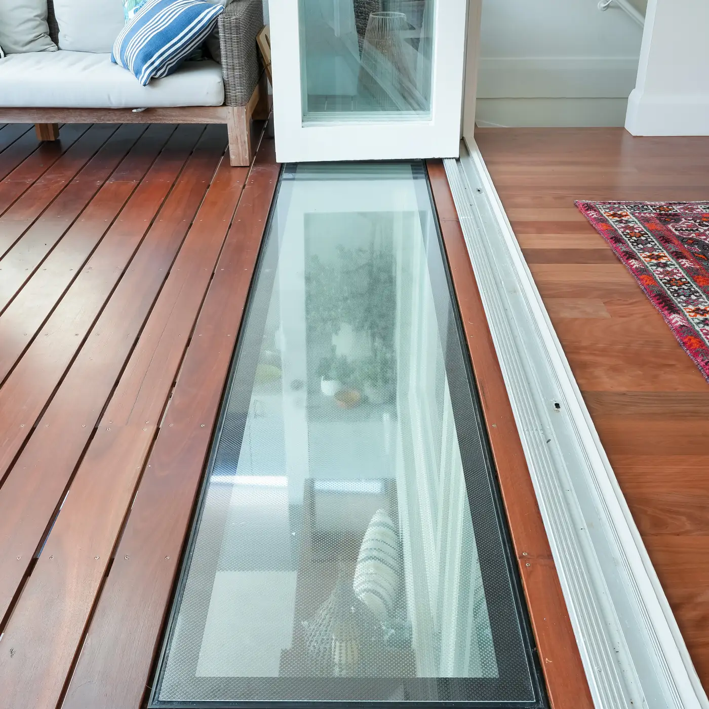 Glazed floor panel set into the deck, bringing daylight to the room below, Castlecrag
