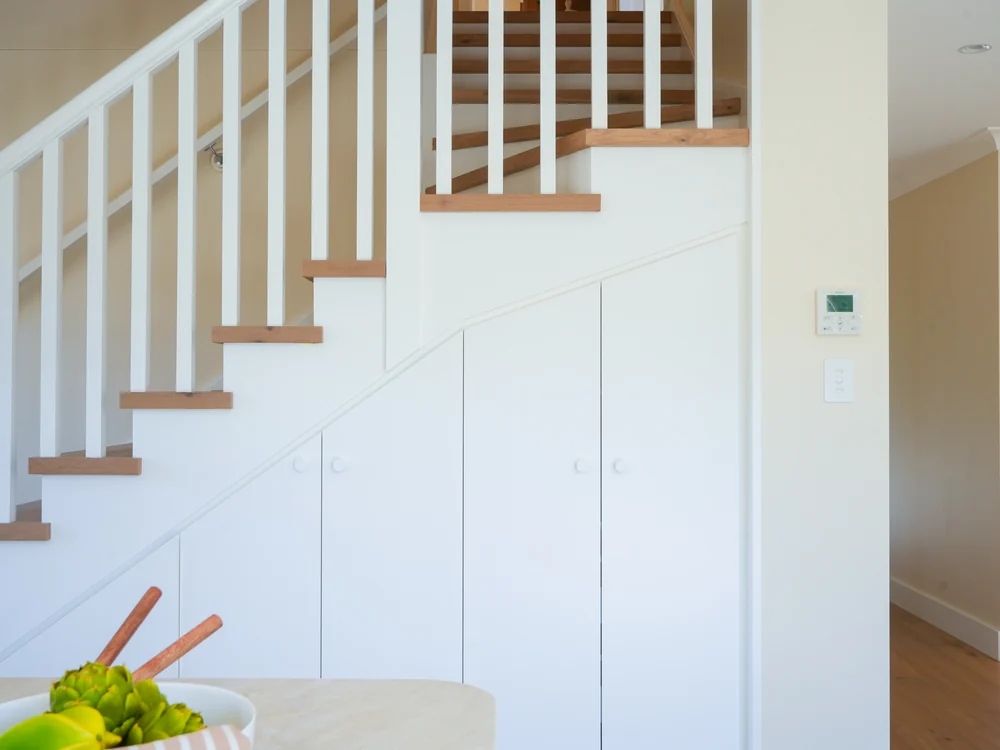 The new staircase with storage joinery built into the space beneath it